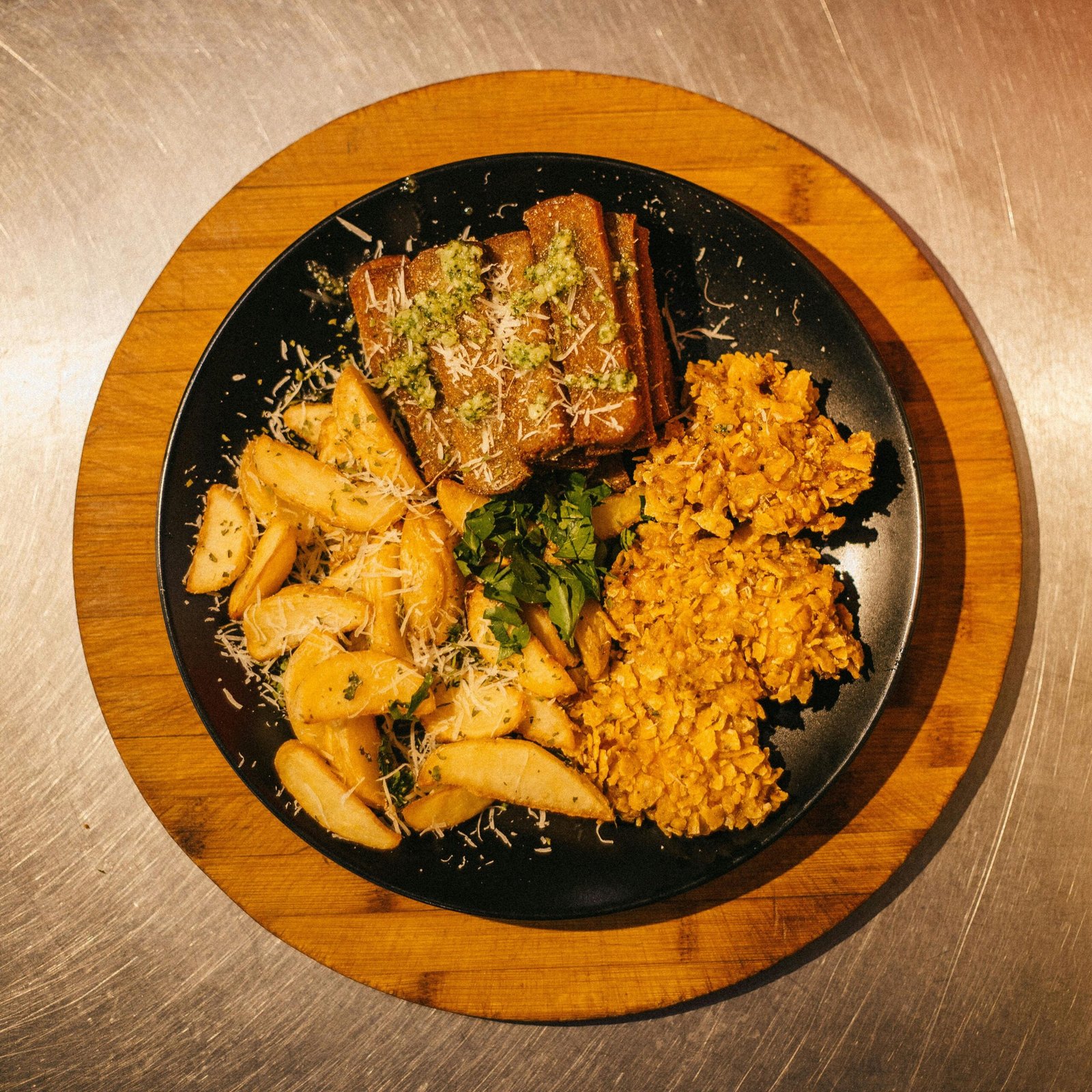 Delicious plant-based meal with roast potatoes, lentils, and tempeh, perfect for a savory dinner.